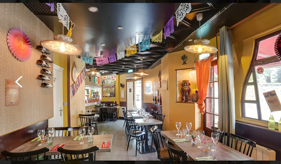 Historic photo of Eltequila restaurant's founding team in the original kitchen, showing the passion and dedication that started our culinary journey